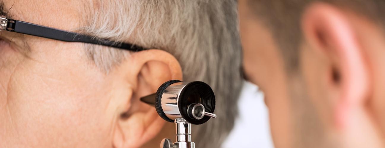 doctor looking in a patient's ear