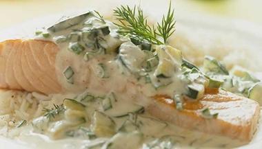 salmon with dill sauce on plate