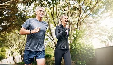 exercise and heart health - mature couple jogging