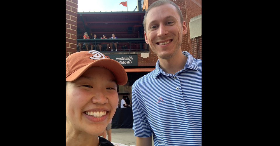 two chief residents smiling in orioles hats